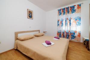 Postel nebo postele na pokoji v ubytování Rooms Mande