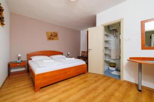 Posteľ alebo postele v izbe v ubytovaní Apartments Ruzica F