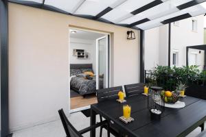 a dining room with a table and a room with a bed at Apartment Lotta with garden in Tar +20 photos