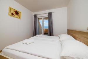 Posteľ alebo postele v izbe v ubytovaní Apartments Ruzica F