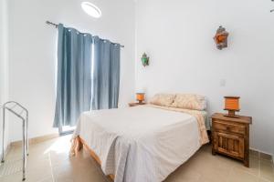 Postel nebo postele na pokoji v ubytování Casa La Arboleda Juriquilla