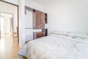 Postel nebo postele na pokoji v ubytování Casa La Arboleda Juriquilla