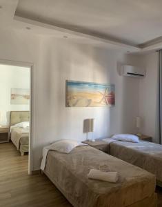 Postel nebo postele na pokoji v ubytování Mare Naxia Hotel