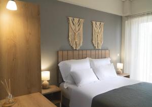 Postel nebo postele na pokoji v ubytování Rondo's Hotel