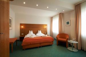 Postel nebo postele na pokoji v ubytování Hotel Klughardt