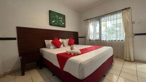 Postel nebo postele na pokoji v ubytování Abian Srama Hotel and Spa