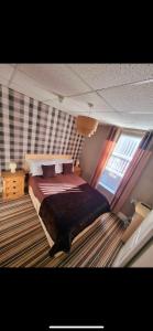 a bedroom with a large bed in a room at The Montclair in Blackpool