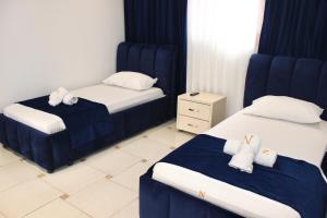 Katil atau katil-katil dalam bilik di Qeparo Napolon Complex