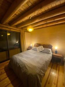 Postel nebo postele na pokoji v ubytování Casa con borde de lago Vichuquen + 18 fotografií