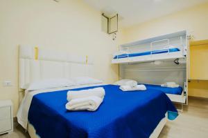 Letto o letti in una camera di Basso ai Quartieri experience