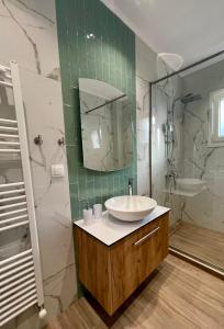 a bathroom with a sink and a mirror at Cashmere axd in Alexandroupoli +24 photos