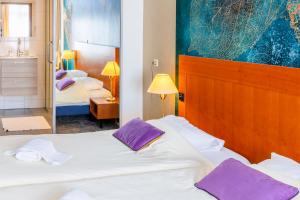 Postel nebo postele na pokoji v ubytování Hotel Het Landhuis