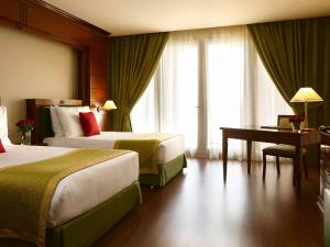 Postel nebo postele na pokoji v ubytování MOVE INN Jeddah Hotel + 37 fotografií