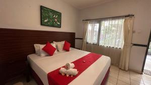 Postel nebo postele na pokoji v ubytování Abian Srama Hotel and Spa