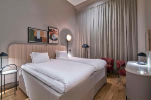 Letto o letti in una camera di Scandic Södra Kajen