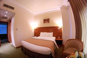 Voodi või voodid majutusasutuse Sadeen Amman Hotel toas