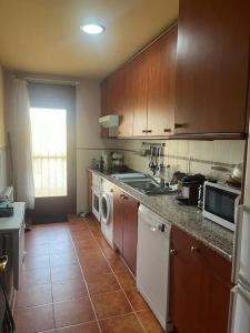 Kuchyň nebo kuchyňský kout v ubytování La Casita del Pozo de las Paredes