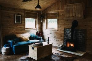 Posezení v ubytování Honeywood Farm Cabins