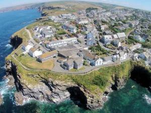 an aerial view of a house on a cliff at Castaway, Port Isaac Bay Holidays in Port Isaac