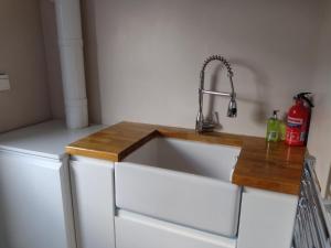a kitchen counter with a sink in a kitchen at Park Avenue in Newcastle