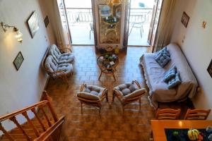 an overhead view of a living room with couches and chairs at Amorosa House in Symi