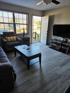 a living room with a couch and a coffee table at Mountain View Retreat 5 min to LMU in Harrogate