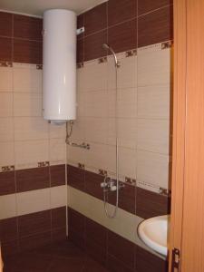 a bathroom with a shower and a sink at Studio Lazur in Burgas