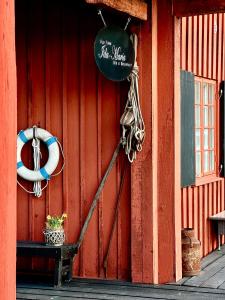 a red building with a sign on the side of it at Old Town B&B Ida-Maria in Porvoo
