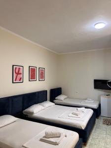 Postel nebo postele na pokoji v ubytování Duka Rooms