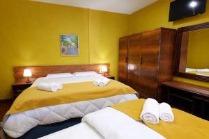 Postel nebo postele na pokoji v ubytování Guesthouse n'Odë