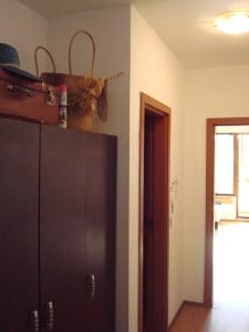 a room with a cabinet with a basket on top of it at Studio Lazur in Burgas City