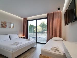 Кровать или кровати в номере Villa Tonia Livadh Himare