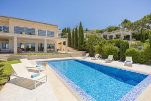 a villa with a swimming pool and a house at Villa Garau / Heura 8 in Alcudia