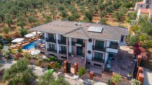 an aerial view of a house with a pool at Cunda EYE in Cunda