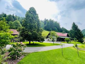 a view of a park with trees and a building at Mr. Bens cottage in Škofja Loka