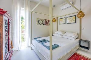 a bedroom with a bed and a large window at Villa Menta 4 in Malinska +26 photos