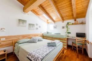 Postel nebo postele na pokoji v ubytování Cà Ulivi