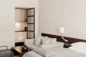 Postel nebo postele na pokoji v ubytování Hotel Bergs Suites