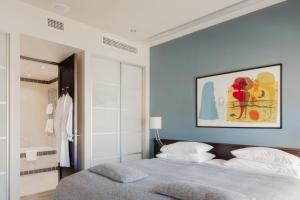 Postel nebo postele na pokoji v ubytování Hotel Bergs Suites