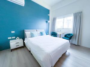 Een bed of bedden in een kamer bij 沙沙民宿