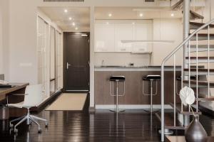 Kuchyň nebo kuchyňský kout v ubytování Hotel Bergs Suites