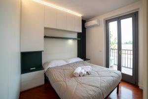 Posteľ alebo postele v izbe v ubytovaní VILLA FENIX MILANO