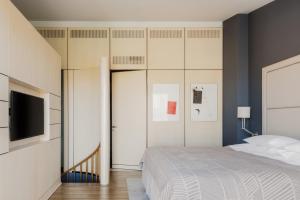 Postel nebo postele na pokoji v ubytování Hotel Bergs Suites