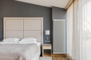 Postel nebo postele na pokoji v ubytování Hotel Bergs Suites