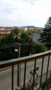 a balcony with a view of a street and a city at Penzion Premona in Nitra