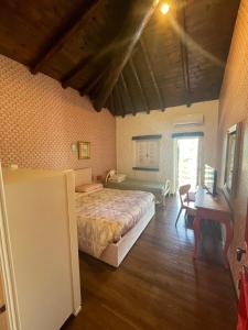 Postel nebo postele na pokoji v ubytování B&B VILLA LUPIDI