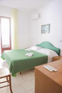 Postel nebo postele na pokoji v ubytování Hotel Cesotta