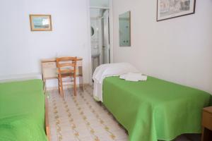 Postel nebo postele na pokoji v ubytování Hotel Cesotta + 37 fotografií