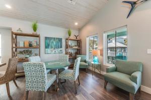 a dining room with a table and chairs at Marlin Madness BB909 in Port Aransas