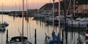 a group of boats docked in a marina at sunset at Casa Il Gelso in Cattolica